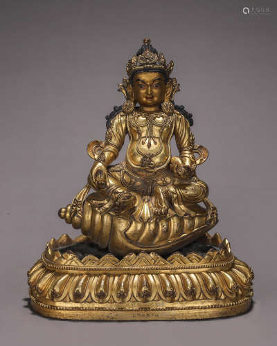 A gilding copper yellow Jambhala buddha statue