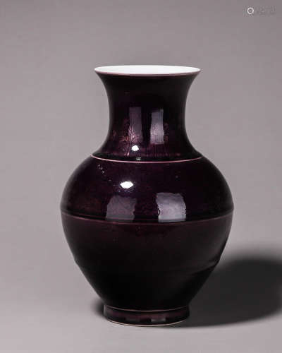 An eggplant purple flower carved porcelain jar