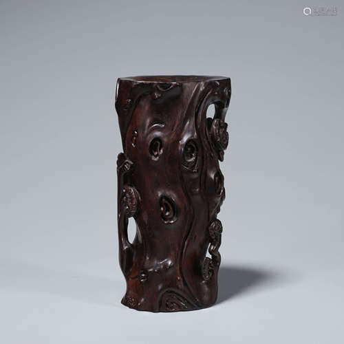 A red sandalwood flower holder