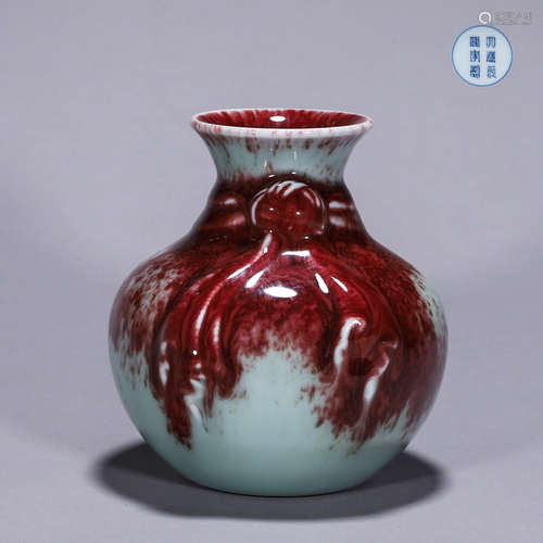 A red glazed porcelain vase