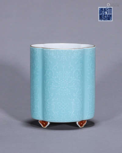 A celeste glazed flower carved porcelain brush pot