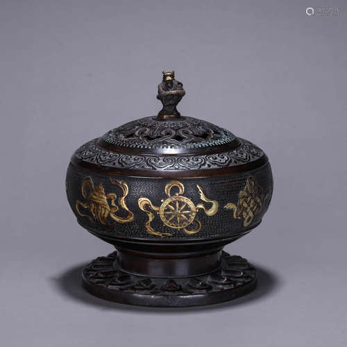 A copper dragon incense burner