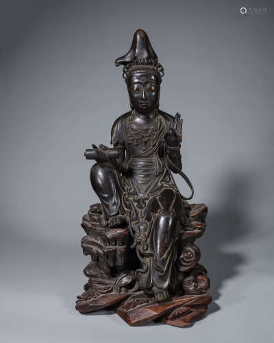 A copper sitting Guanyin statue
