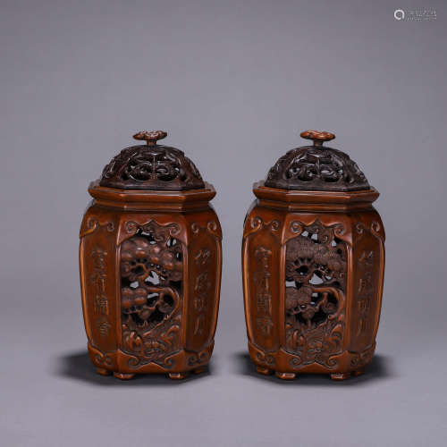 A pair of hollowed out fragrant rosewood incense burners