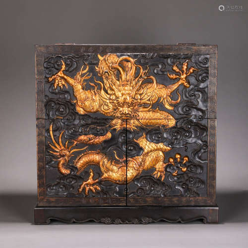 A gilt cloud and dragon red sandalwood bookcase