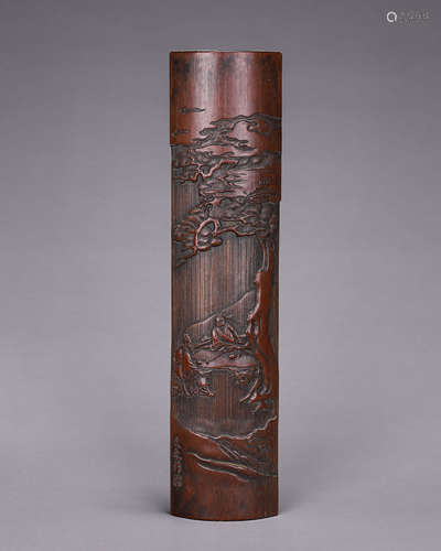 A carved bamboo arm rest