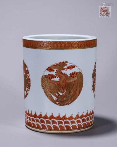 An iron red gilt dragon and phoenix porcelain brush pot
