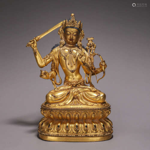 A gilding copper four-armed Manjusri bodhisattva statue