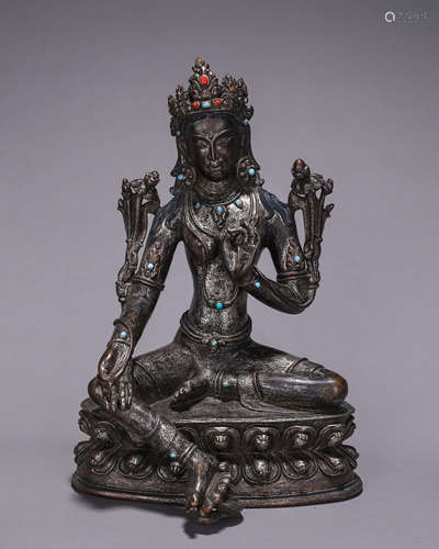 A silver green tara statue