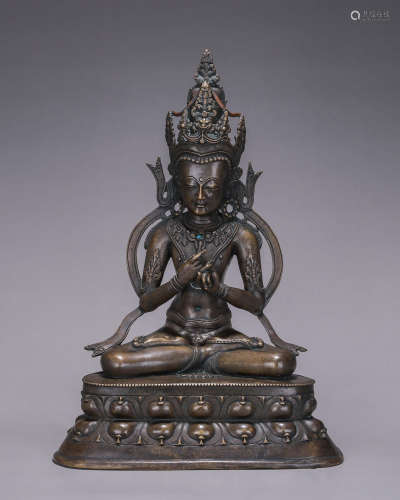 A copper Vairocana buddha statue