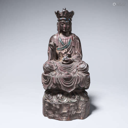 A rosewood buddha statue