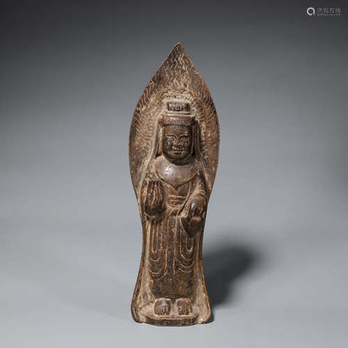 A pottery Guanyin statue