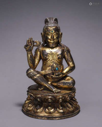 A gilding copper buddha statue