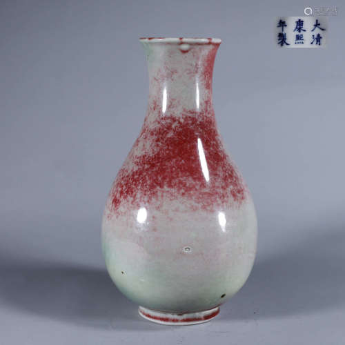 A red porcelain vase