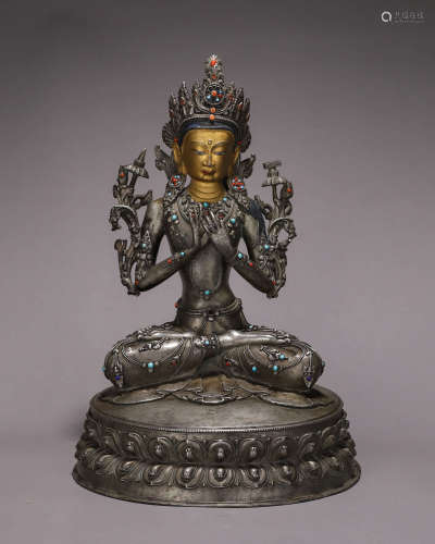 A silver Manjusri bodhisattva statue