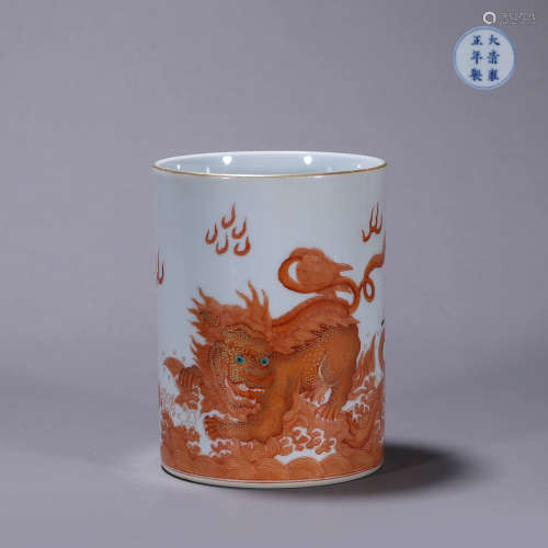 An iron red gilt lion porcelain brush pot