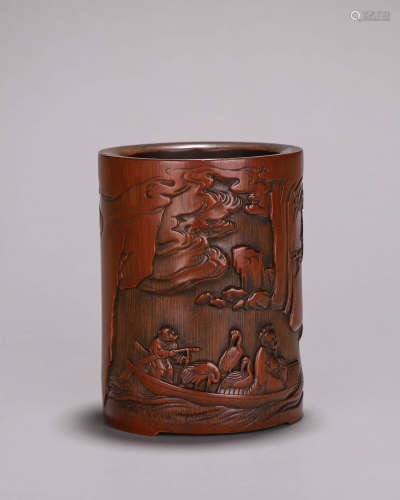 A carved bamboo brush pot