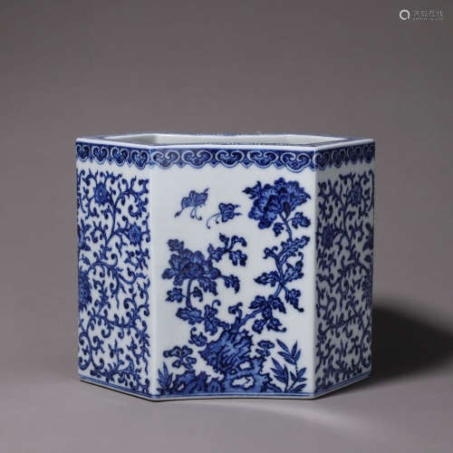 A blue and white flower and butterfly porcelain brush pot