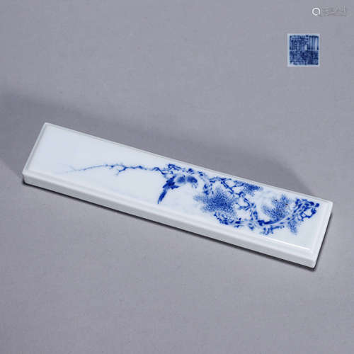 A blue and white bird and flower porcelain paperweight