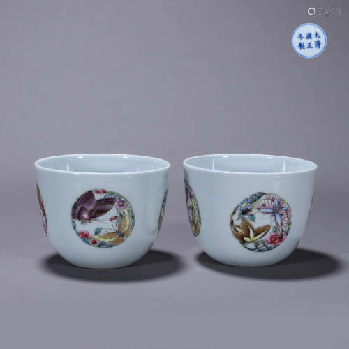 A pair of famille rose flower and butterfly porcelain cups