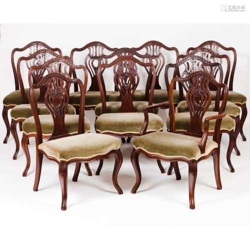 A George III set of twelve chairs and a three seat settee
