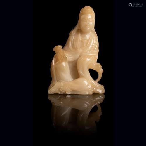 PALE YELLOW SOAPSTONE CARVING OF A SEATED GUANYIN Q…