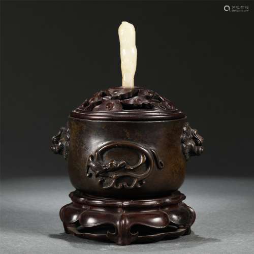 A BRONZE INCENSE BURNER WITH DOUBLE BEAST HANDLES