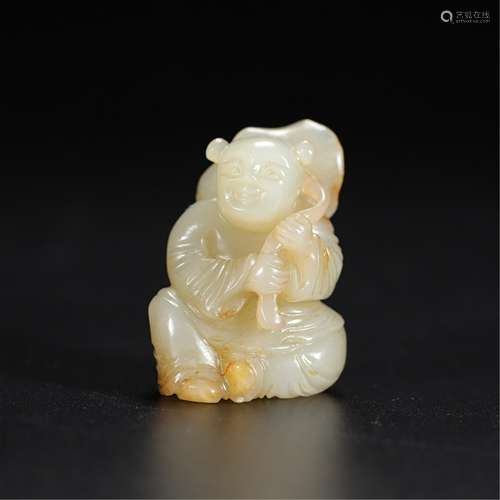 A JADE CARVING OF BOY WITH LOTUS