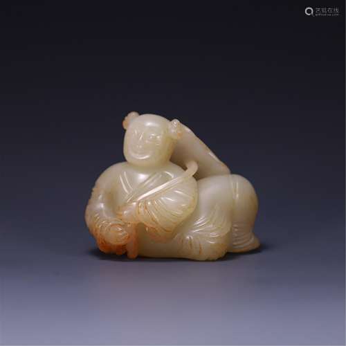 A JADE CARVING OF BOY WITH LOTUS