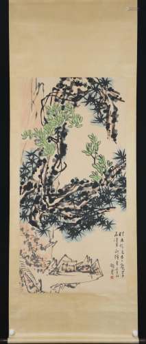 A CHINESE PAINTING OF PINE AND ROCKS