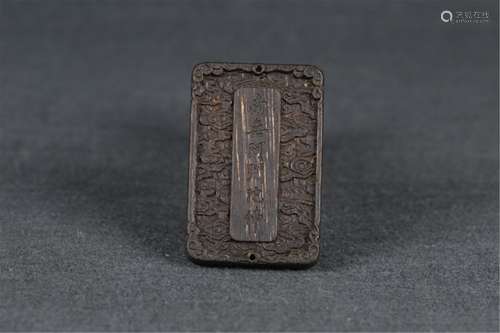 AN INSCRIBED CHENXIANG WOOD BUDDHA PENDANT