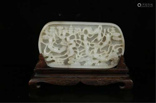 A HOLLOW CARVED JADE FIGURAL DECORATION