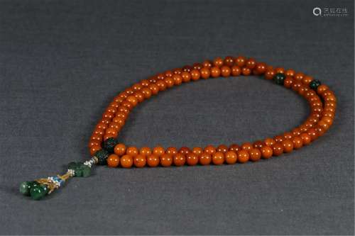 A STRING OF CLOUDY AMBER PRAYER BEADS