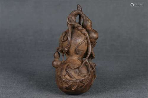 A CHENXIANG WOOD CARVED DOUBLE-GOURDS DECORAT…