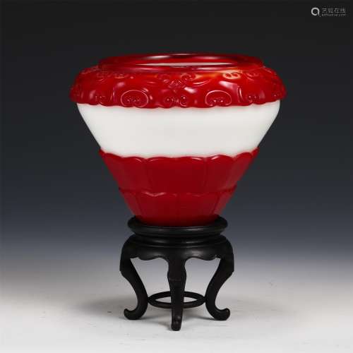 A RED AND WHITE GLASS CARVED CUP