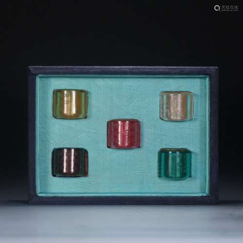 GROUP OF INSCRIBED GLASS THUMB RINGS