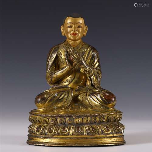 A GILT BRONZE BUDDHA STATUETTE INLAID WITH SILVER