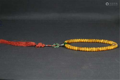 A STRING OF CLOUDY AMBER PRAYER BEADS