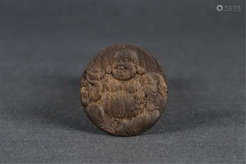 A CHENXIANG WOOD CARVED MAITREYA PENDANT