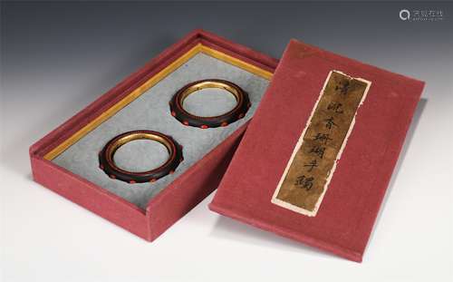 PAIR OF CORAL INLAID CHENXIANG WOOD BANGLES