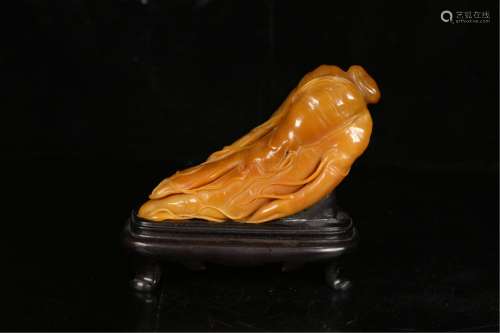 A GINSENG SHAPED SOAPSTONE CARVING