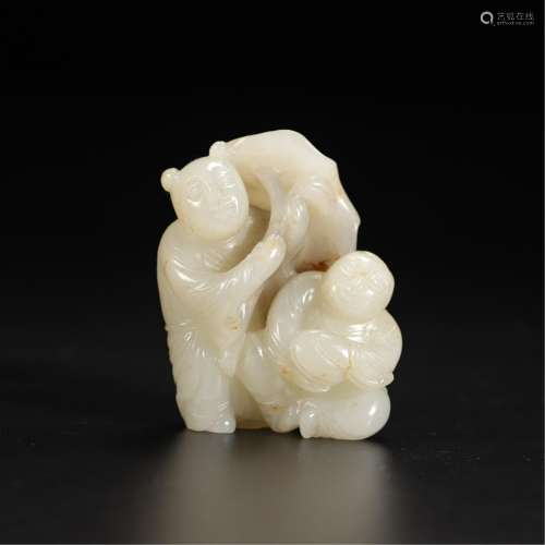 A JADE CARVING OF KIDS WITH LOTUS