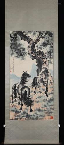 A CHINESE PAINTING OF HORSES UNDER THE TREE