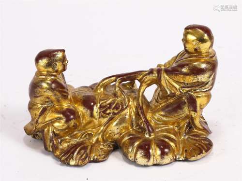 A GOLD PAINTED WOODEN FIGURAL DECORATION