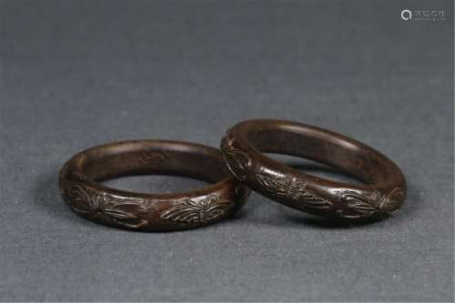 PAIR OF CARVED CHENXIANG WOOD BANGLES