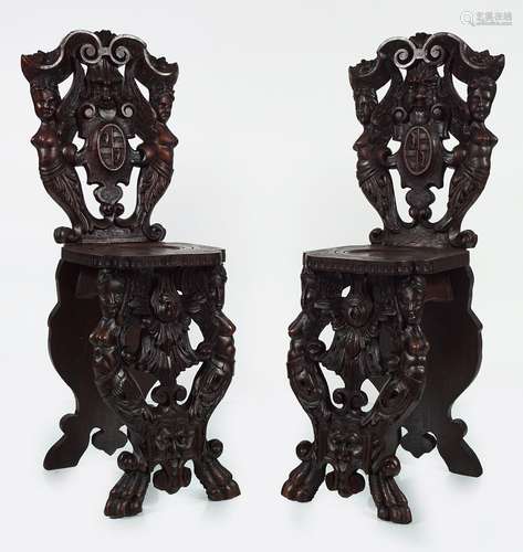 PAIR OF 19TH-CENTURY WALNUT ARMORIAL HALL CHAIRS