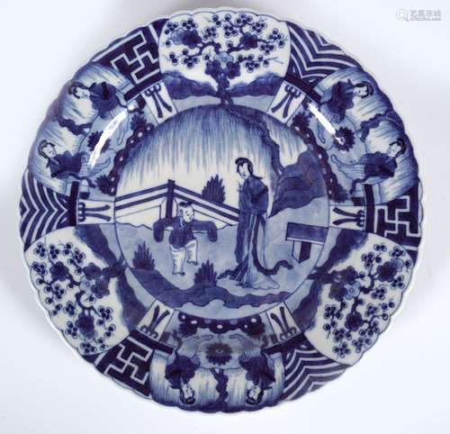 CHINESE SCALLOP RIMMED BLUE AND WHTIE PLATE