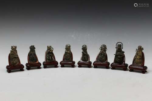 Eight Chinese silver figurines on wooden stands