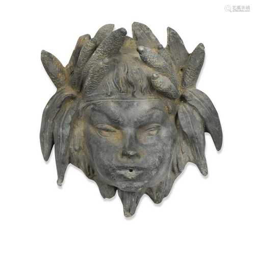 A cast lead fountain mask,