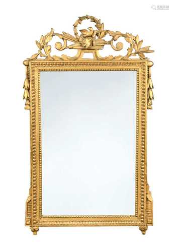 An empire style carved giltwood mirror,